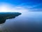 Aerial view of seashore with beach, lagoons and coral reefs. Coastline with sand and water. Tropical landscape. Aerial photography