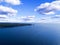 Aerial view of seashore with beach, lagoons and coral reefs. Coastline with sand and water. Tropical landscape. Aerial photography