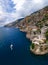 Aerial view of the seashore of southern Italy. Boat. Incredible beauty panorama of mountains and sea. Travel and tourism. Summer