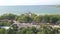 Aerial view of seaside.  A lot of trees and some rooftop of buildings