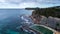 Aerial view of seaside ocean swimming pool set against rock cliffs at Bilgola Beach, Sydney Australia