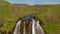 Aerial view of Seljalandsfoss waterfall in Iceland. Epic drone view of water flowing through high cliffs. Amazing and