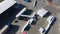 Aerial view of a semi trucks with cargo trailers standing on warehouses ramps for loading unloading goods on the big logistics