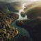 Aerial view of serene river winding through forest