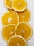 Aerial view of several slices of freshly cut oranges