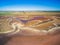 Aerial view of shallow salt lake and farmlands.