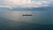 Aerial view ship sailing gloomy horizon slow motion. Vessel floating calm ocean