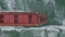 Aerial view of the ship slowly moving through ice floes