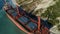 Aerial view of the ship washed ashore. Shot. Top view of an abandoned old and rusty shipwreck on a stormy day