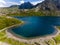 Aerial view of the shoreline of a beautiful mountain lake surrounded by hiking trails on Snowdon, Wales Llyn Glaslyn and the