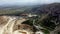 Aerial view shot of a large quarry between mountains