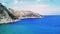 Aerial view showcases mountain, coastline meeting in Turkey bay. Landscape captures harmony between mountain, coastline