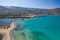 Aerial view showing the causeway connecting Elounda to Kolokitha island along with the remains of the Minoan city of Olous Crete