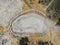 Aerial view of Sikidang crater with the background of sulfur vapor coming out of the sulfur marsh