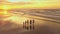 Aerial view of silhouettes of happy family walking and holding the hands each other on beach during sunset