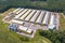 Aerial view on silos and agro-industrial livestock complex on agro-processing and manufacturing plant with modern granary elevator