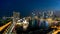 Aerial view of Singapore business district and city at night in