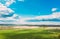 Aerial View. Sky With Clouds Above Countryside Rural Field Landscape In Spring Summer Cloudy Day. Scenic Sky With Fluffy