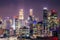 Aerial view of skyline business building and financial district  from rooftop, Modern towers and skyscrapers illuminated at night