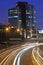 aerial view of skyscraper and corporations at night with highway with traffic Peru