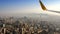 Aerial View of skyscrapers in a haze of the plane engine