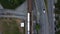 Aerial view of skytrain subway with cars on a road next to it in Vancouver downtown