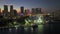 Aerial view of Skyviews Miami Observation Wheel at Bayside Marketplace with high illuminated skyscrapers of Brickell