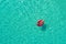 Aerial view of slim woman swimming on the swim ring in the trans