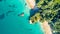 Aerial view on a small beach surrounded by rocks and forest. Coromandel, New Zealand