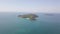 Aerial view of a small island lagoon in the middle of the blue ocean.