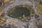 Aerial view on an small lake in an old abandoned open quarry. Stone for construction industry. Nature scene. County Galway,