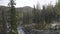 Aerial view of a small mountain river with big stones. Clip. Picturesque natural landscape, spring or autumn view of