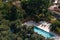 Aerial view of small rectangle swimming pool in olive trees, Italy, travel vacation concept