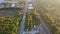 Aerial view of and small residential area and long railroad located area loading station road with yellow autumn forest