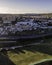 Aerial view of a small residential district along a golf court and a busy road at sunset, Cruz Quebrada-Dafundo, Lisbon, Portugal