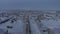 Aerial view of a small town in the north pole of Russia in winter. Establishing shot the landscape of a small town in