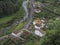 Aerial view of small village Faial da Terra with cascading river, Sao Miguel, Azores.