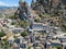 Aerial view of the Small village of Pentedattilo, church and ruins of the abandoned village, Greek colony on Mount Calvario, whose