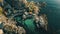 Aerial View of a Small Village on a Rocky Shore, Aerial view of a small fishing village on a rugged coastline, AI Generated