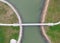 Aerial view of small walking bridge across lake