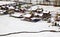 aerial view of small wooden houses in a village  in early winter