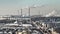 aerial view on smoked pipes of chemical enterprise plant with snow.