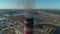 Aerial view of smoking chimneys of CHP plant, coal-fired power station, close-up