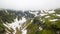 Aerial view of the snow in a canyon high in the Alpine mountains