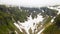 Aerial view of the snow in a canyon high in the Alpine mountains