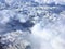 Aerial view of snow capped mountains and clouds over Alaska