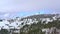 Aerial view of snow-covered German Black Forest landscape in winter. Cedar forests, ski resort and tower on mountaintop