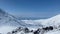 Aerial view of the snow-covered Kamen volcano and its surroundings at an altitude of 3900 meters.