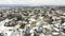 Aerial view snow covered residential houses with downtown skyline in distance background near Dallas, Texas, America