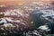 Aerial view of snowy landscape in winter with mountains and lakes in Norway at sunset